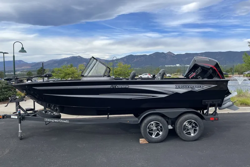 Slide: The Image of 2026 Ranger VX1888 WT boat on trailer, scenic mountain backdrop. - 0