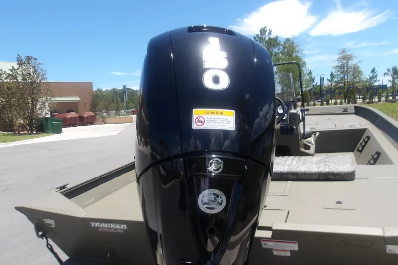 Slide: The Image of 2026 Tracker Grizzly 2072 CC boat with powerful 150 HP engine, outdoors. - 4