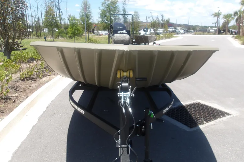 Slide: The Image of 2026 Tracker Grizzly 2072 CC boat on trailer, parked outdoors on a sunny day. - 12