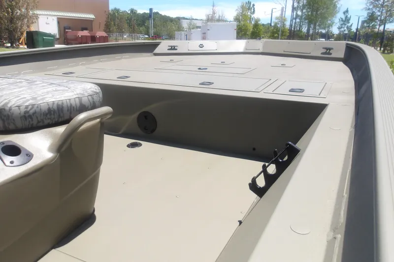 Slide: The Image of 2026 Tracker Grizzly 2072 CC boat interior with seating and storage compartments. - 8