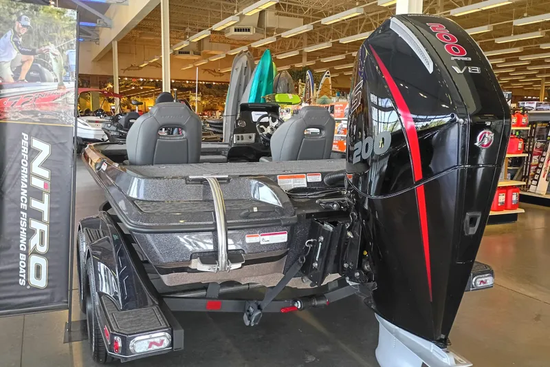 Slide: The Image of 2026 Nitro Z19 XL fishing boat with powerful V8 engine displayed indoors. - 3