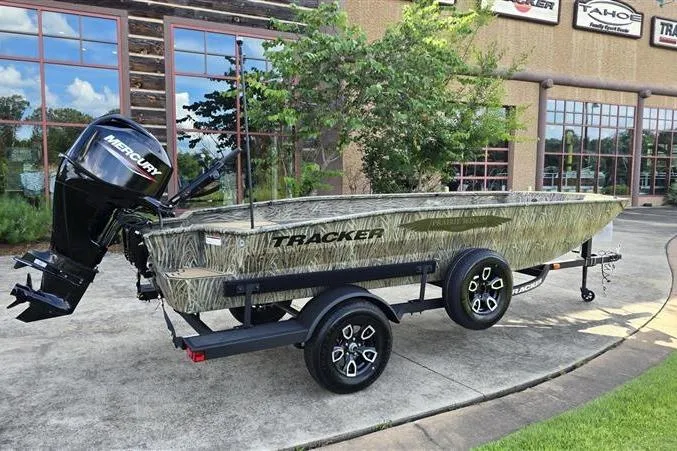Slide: The Image of 2026 Tracker Grizzly 1650 T Prairie Wings Edition boat with camo design on trailer. - 6