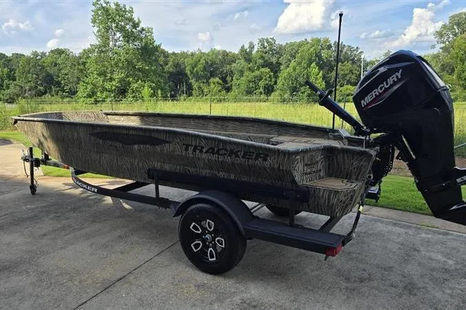 Slide: The Image of 2026 Tracker Grizzly 1650 T Prairie Wings Edition boat with Mercury engine on trailer. - 4