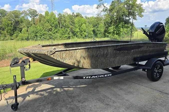 Slide: The Image of 2026 Tracker Grizzly 1650 T Prairie Wings Edition boat on trailer, outdoors. - 3