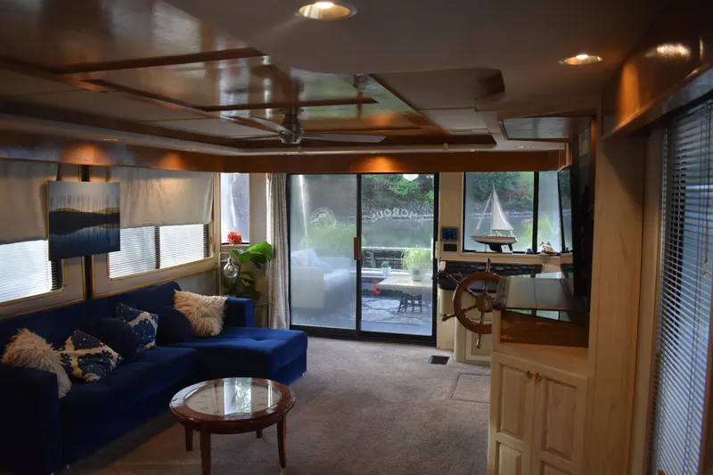 Slide: The Image of Luxurious 1996 Stardust Cruisers houseboat interior with plush seating and elegant decor. - 25