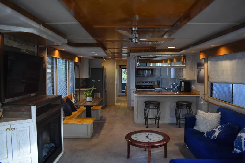 Slide: The Image of Interior of a 1996 Stardust Cruisers houseboat with modern kitchen and cozy living area. - 26