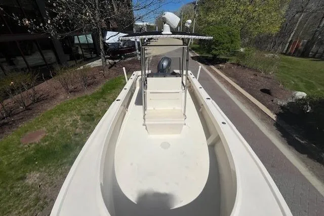 Slide: The Image of 2005 Parker 2100 Center Console boat on a paved path, surrounded by greenery. - 3