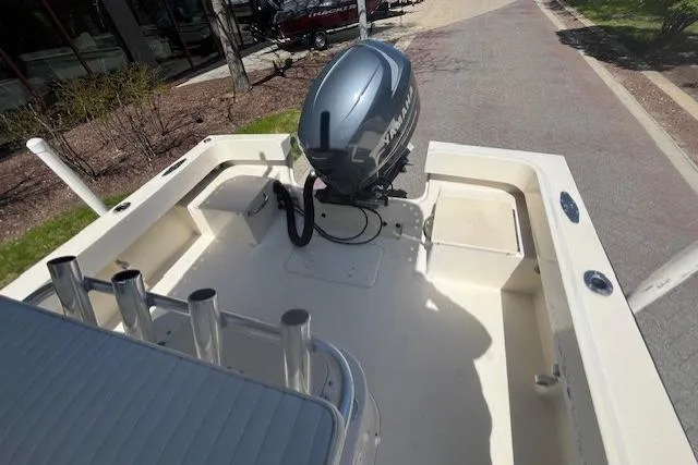 Slide: The Image of 2005 Parker 2100 Center Console boat with Yamaha outboard motor, docked on a sunny day. - 7