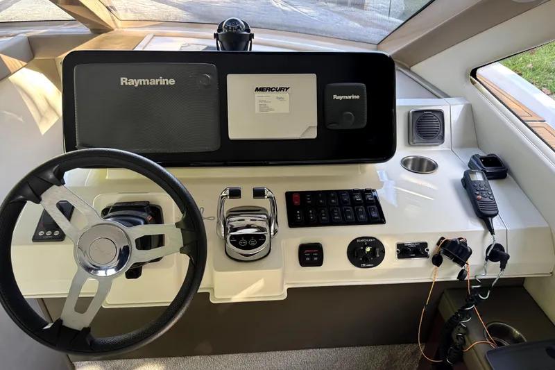Slide: The Image of 2015 Carver 40 Command Bridge helm with Raymarine equipment. - 27
