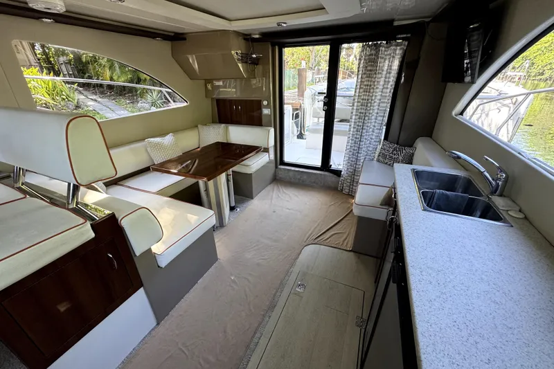Slide: The Image of Interior of 2015 Carver 40 Command Bridge with kitchen and seating area. - 3