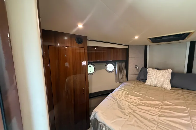 Slide: The Image of Luxurious bedroom interior of 2015 Carver 40 Command Bridge yacht with wood accents. - 45