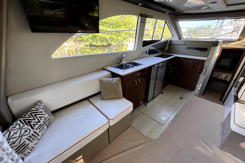 Slide: The Image of Interior of 2015 Carver 40 Command Bridge with modern kitchen. - 5