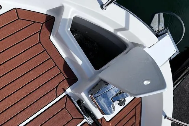 Slide: The Image of Deck view of 2021 Ranger Tugs R-31 CB with wood finish and anchor storage. - 22