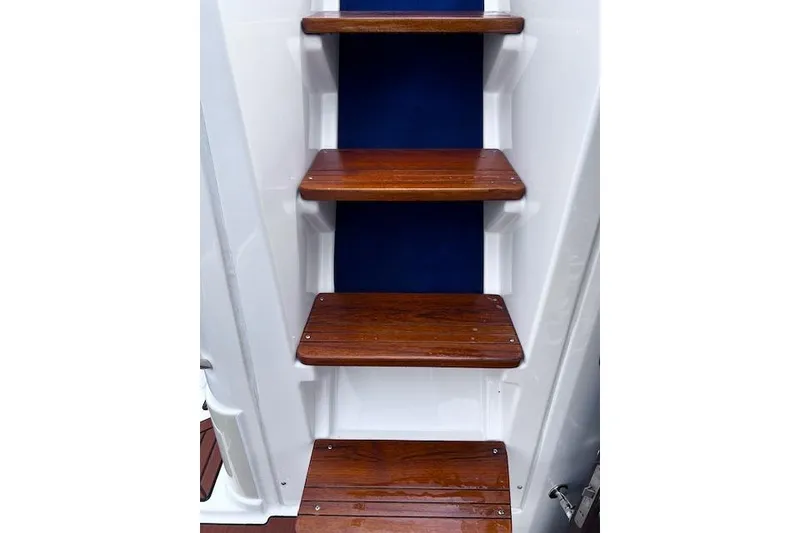 Slide: The Image of Wooden steps on a 2021 Ranger Tugs R-31 CB boat. - 34