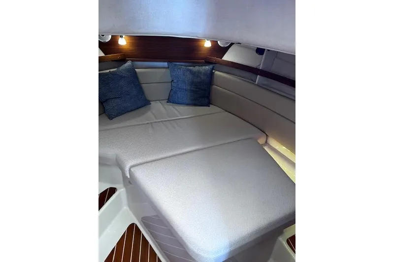 Slide: The Image of 2021 Ranger Tugs R-31 CB cabin interior with cozy seating and cushions. - 52