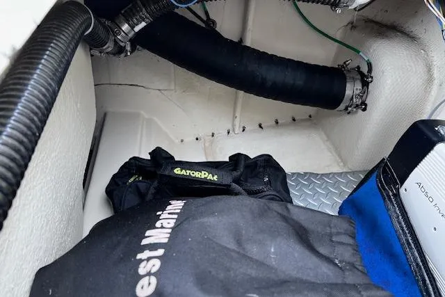 Slide: The Image of Storage compartment of 2021 Ranger Tugs R-31 CB with marine equipment and accessories. - 74