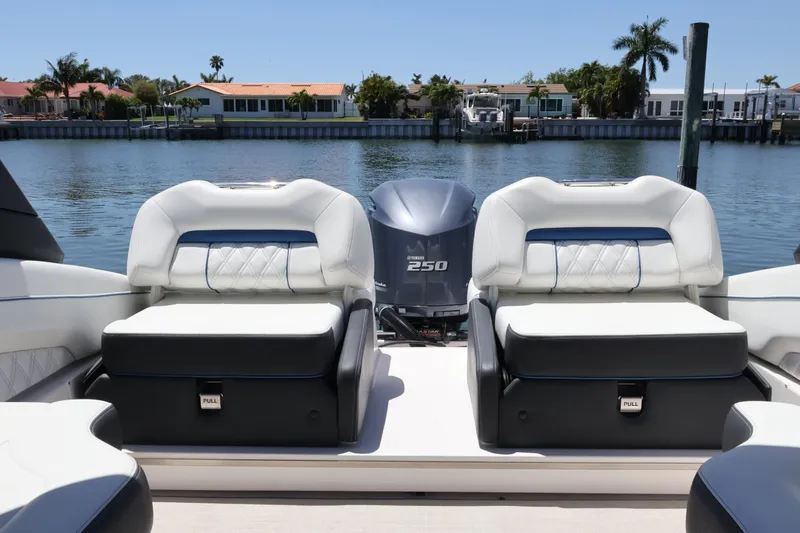 Slide: The Image of 2020 Regal LX4 boat interior with plush seating and Yamaha 250 engine. - 11