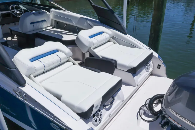 Slide: The Image of 2020 Regal LX4 boat interior with luxurious white seating and modern design. - 14