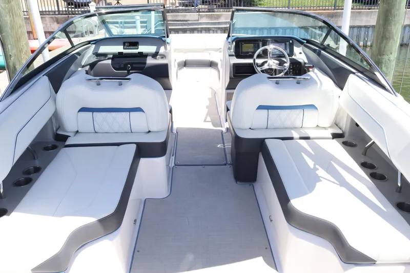 Slide: The Image of Interior of a 2020 Regal LX4 boat with luxurious seating and modern dashboard. - 15