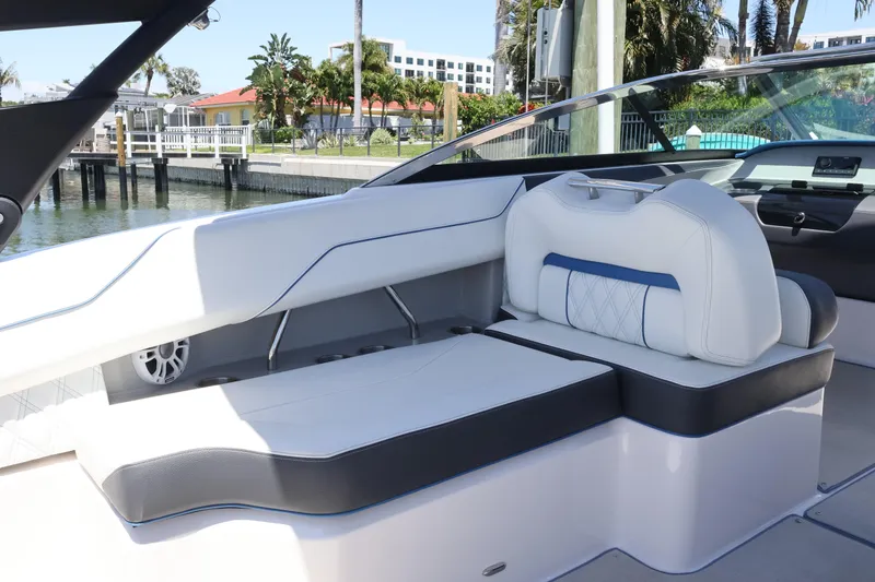 Slide: The Image of Luxurious interior of a 2020 Regal LX4 boat with white and blue seating. - 17