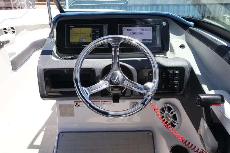 Slide: The Image of Steering console of 2020 Regal LX4 boat with digital displays and controls. - 23