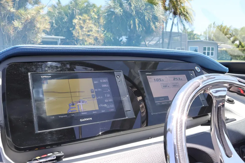 Slide: The Image of 2020 Regal LX4 dashboard with Garmin GPS displays and chrome steering wheel. - 24