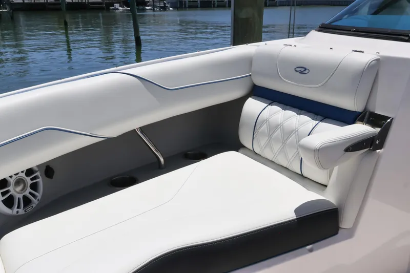 Slide: The Image of Luxurious seating on a 2020 Regal LX4 boat, featuring elegant white upholstery and stylish design. - 36