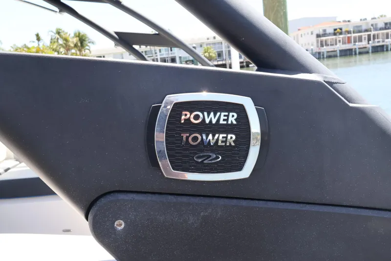 Slide: The Image of 2020 Regal LX4 Power Tower emblem on a boat, with waterfront background. - 41