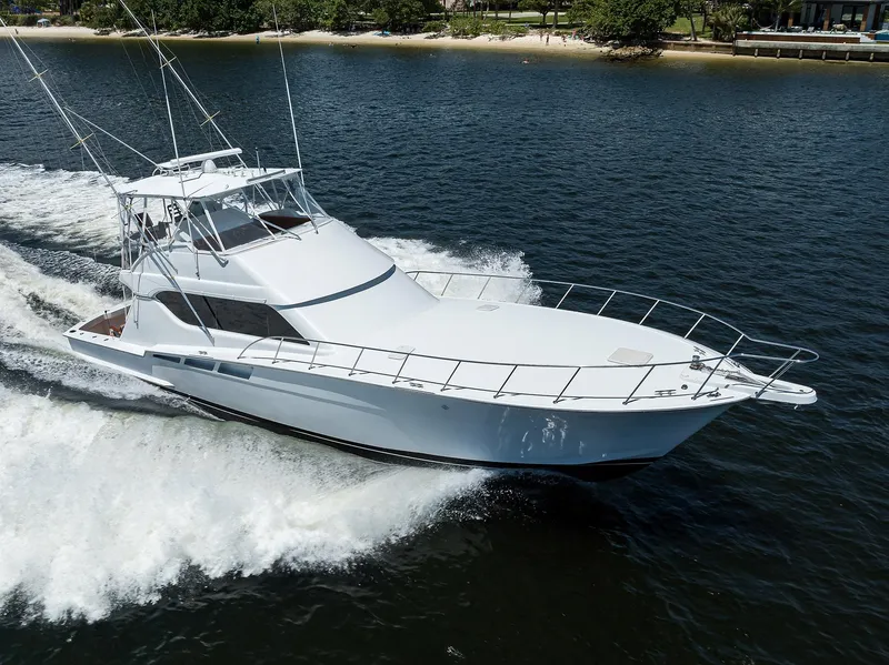 Slide: The Image of 2001 Hatteras 60 Convertible yacht cruising on open water. - 1