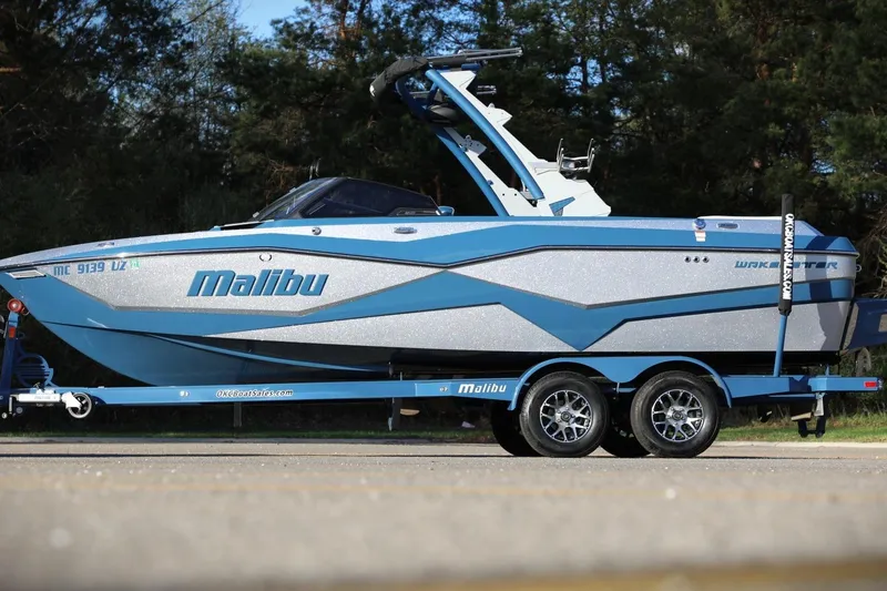 The Image of 2023 Malibu Wakesetter 22 LSV boat on trailer, parked outdoors. - 0