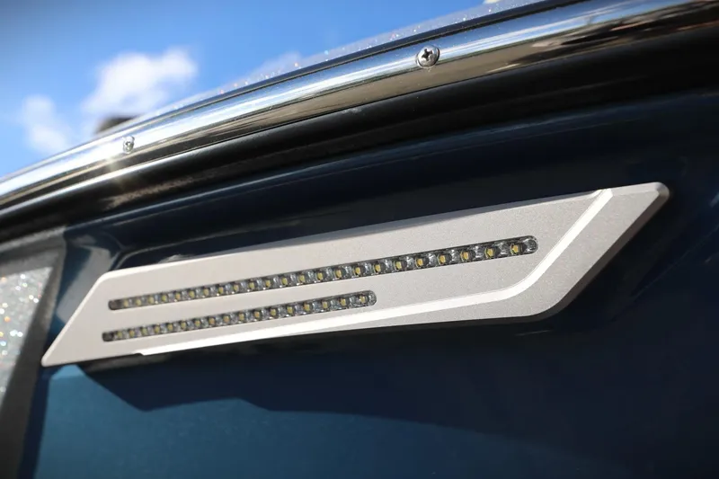 Slide: The Image of 2023 Malibu Wakesetter 22 LSV boat detail with sleek LED lighting. - 12