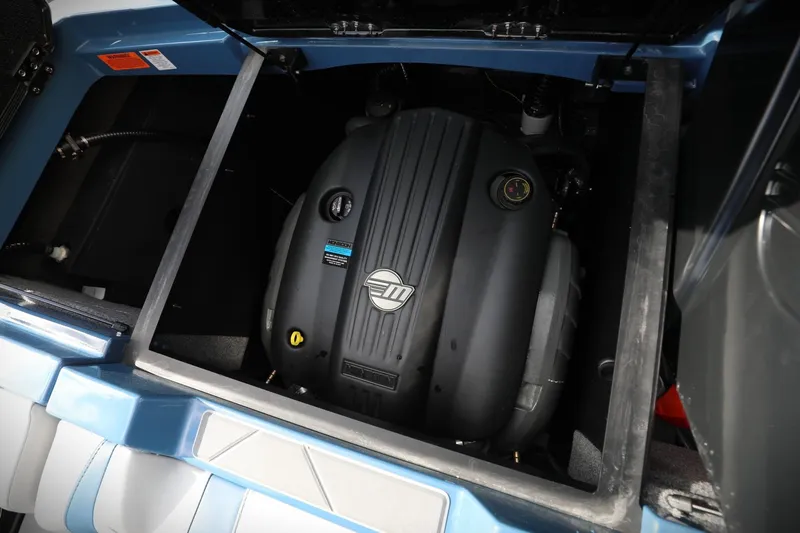 Slide: The Image of 2023 Malibu Wakesetter 22 LSV engine compartment, showcasing powerful marine engine. - 13