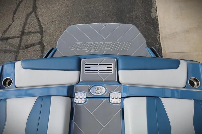 Slide: The Image of 2023 Malibu Wakesetter 22 LSV boat interior, featuring sleek blue and gray design. - 17