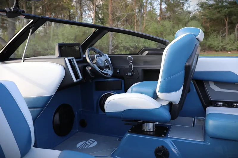 Slide: The Image of 2023 Malibu Wakesetter 22 LSV interior with blue and white seating, modern dashboard. - 20
