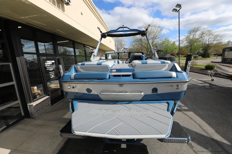 Slide: The Image of 2023 Malibu Wakesetter 22 LSV boat displayed outdoors, showcasing sleek design and seating. - 21