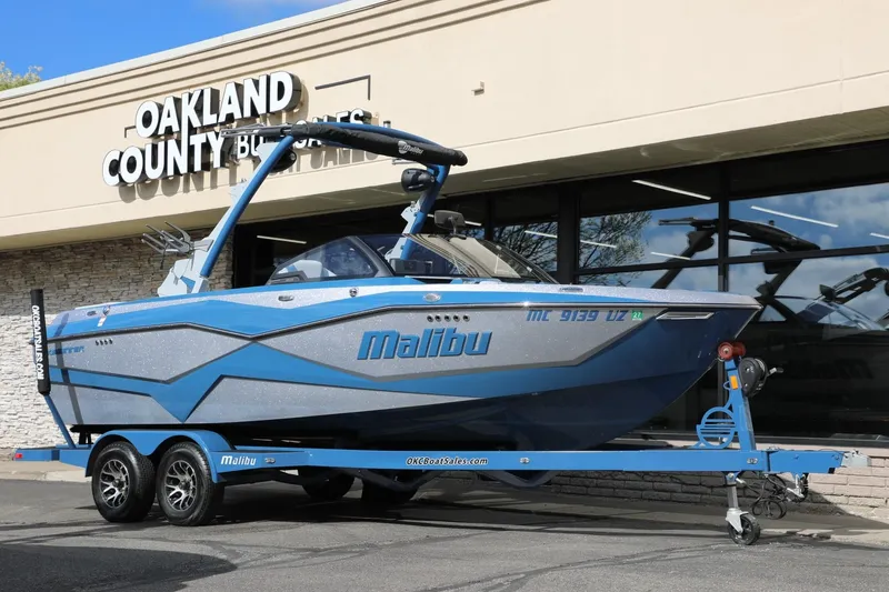 Slide: The Image of 2023 Malibu Wakesetter 22 LSV boat on trailer outside dealership. - 26