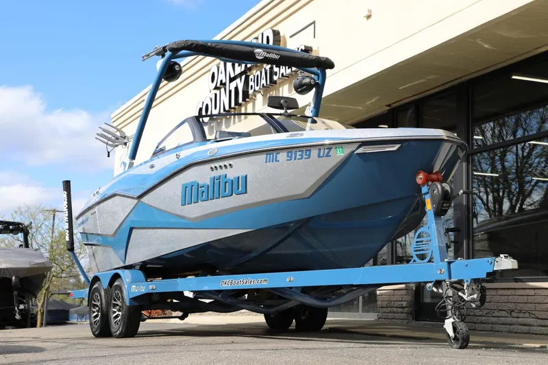 Slide: The Image of 2023 Malibu Wakesetter 22 LSV boat on trailer outside dealership. - 6