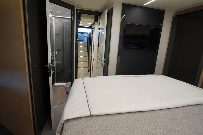 Slide: The Image of Luxurious interior of 2016 Pershing 70 yacht bedroom with modern design and amenities. - 19