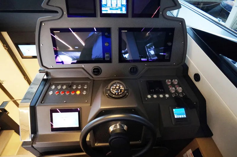 Slide: The Image of Control panel of a 2016 Pershing 70 yacht with advanced navigation displays. - 2