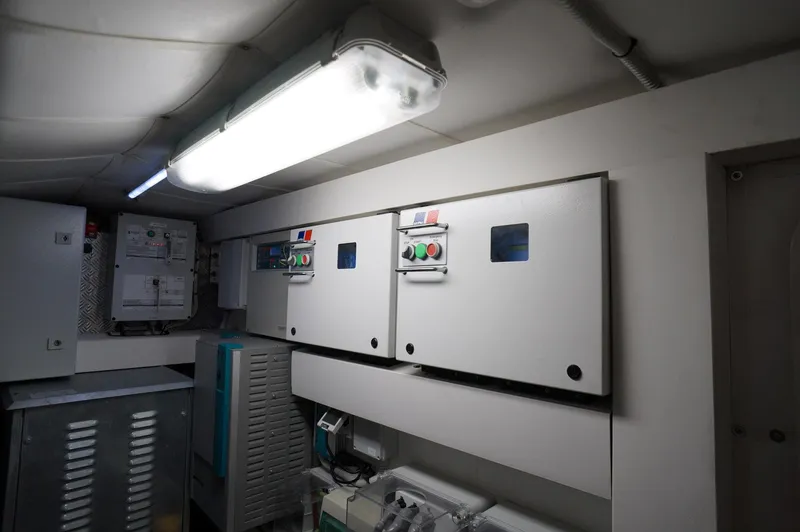 Slide: The Image of Electrical control panels inside a 2016 Pershing 70 yacht. - 37