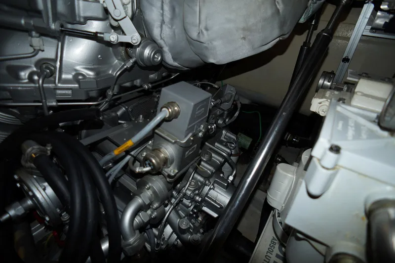 Slide: The Image of Engine components of a 2016 Pershing 70 yacht, showcasing intricate mechanical details. - 49