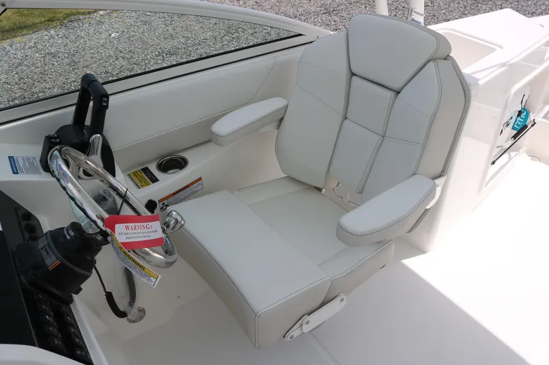 Slide: The Image of Captain's seat and steering wheel of 2026 World Cat 230 SD boat. - 8