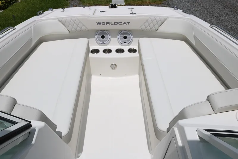 Slide: The Image of 2026 World Cat 230 SD boat interior with white seating and cup holders. - 5