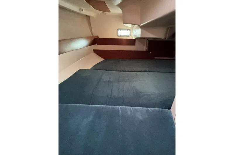 Slide: The Image of Interior cabin of 1995 Beneteau Oceanis 321 sailboat with blue cushions. - 17
