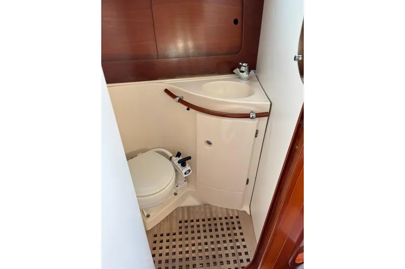 Slide: The Image of Compact bathroom in 1995 Beneteau Oceanis 321 sailboat with toilet and sink. - 18