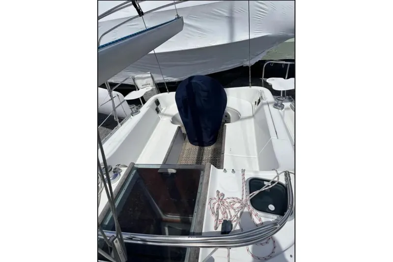 Slide: The Image of Cockpit view of a 1995 Beneteau Oceanis 321 sailboat, showcasing seating and steering area. - 5