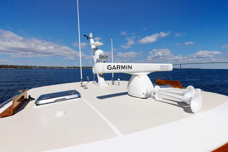 Slide: The Image of Rooftop of 2000 Eastbay 49 yacht with Garmin radar, ocean view, and clear sky. - 12