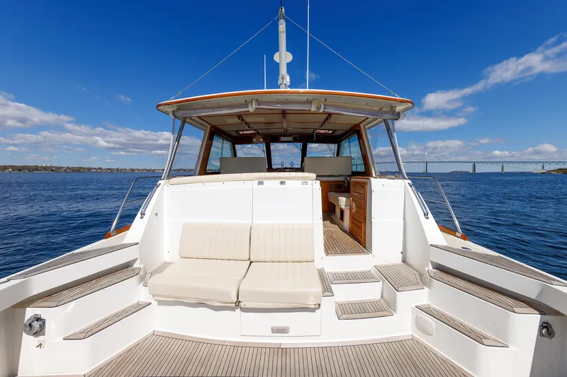 Slide: The Image of Eastbay 49 yacht, 2000 model, with spacious deck and scenic ocean view. - 14