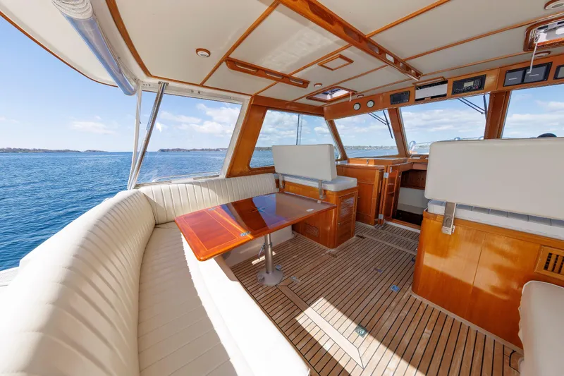 Slide: The Image of Luxurious interior of a 2000 Eastbay 49 yacht with ocean view and elegant seating. - 16