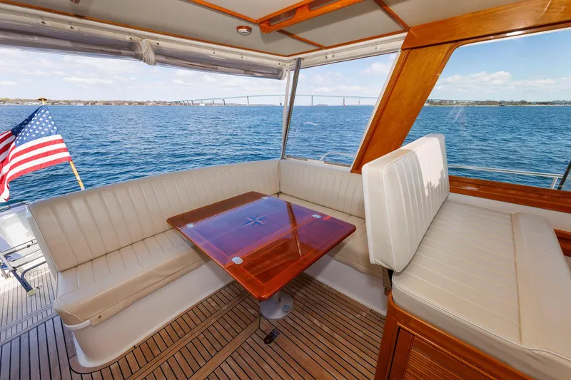 Slide: The Image of Luxurious Eastbay 49 yacht interior with elegant seating and ocean view, 2000 model. - 22